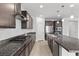 This is a contemporary kitchen featuring granite countertops and stainless steel appliances at 9625 Ponderosa Skye Ct, Las Vegas, NV 89166