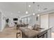 Kitchen island with granite countertop and sink at 9625 Ponderosa Skye Ct, Las Vegas, NV 89166