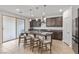 Modern kitchen with island, stainless steel appliances, and dark brown cabinets at 9625 Ponderosa Skye Ct, Las Vegas, NV 89166