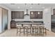 This kitchen island has stylish pendant lighting and comfortable seating at 9625 Ponderosa Skye Ct, Las Vegas, NV 89166