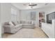 This cozy living room features a plush sofa and television at 9625 Ponderosa Skye Ct, Las Vegas, NV 89166