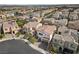 Aerial view of a residential neighborhood showcases well-maintained homes with desert landscaping and mountain views at 9625 Ponderosa Skye Ct, Las Vegas, NV 89166