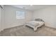 Bright bedroom with gray carpet and a double bed at 10774 Blore Ct, Las Vegas, NV 89166