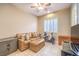 Home office with leather couch, exercise bike, and safe at 12160 Torretta Ct, Las Vegas, NV 89138