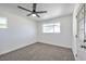 Spacious bedroom with ceiling fan and grey carpet at 1302 Cherokee Ln, Las Vegas, NV 89106