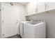 Laundry room with washer, dryer and cabinets at 1308 Royal Creek Ct, North Las Vegas, NV 89031