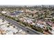 Birds eye view of townhomes in a residential area, with shopping centers and a distant city skyline at 1409 E St Louis Ave # A, Las Vegas, NV 89104