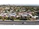 Expansive aerial view of a residential area with lush greenery and the city skyline in the background at 1409 E St Louis Ave # A, Las Vegas, NV 89104