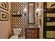 Stylish bathroom with patterned wallpaper and modern vanity at 1409 E St Louis Ave # A, Las Vegas, NV 89104
