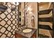 Elegant bathroom with granite vanity, patterned wallpaper, and a large walk-in shower at 1409 E St Louis Ave # A, Las Vegas, NV 89104