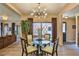 Charming dining area with glass table and modern chandelier at 1409 E St Louis Ave # A, Las Vegas, NV 89104