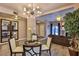Bright dining area with chandelier and views into the living room at 1409 E St Louis Ave # A, Las Vegas, NV 89104