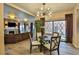 Elegant dining room showcasing a glass-top table and stylish chandelier at 1409 E St Louis Ave # A, Las Vegas, NV 89104
