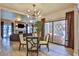 Open dining room with glass table and hardwood flooring at 1409 E St Louis Ave # A, Las Vegas, NV 89104