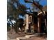 Exterior view of a building with trees and shrubs in front of the building on a sunny day at 1409 E St Louis Ave # A, Las Vegas, NV 89104