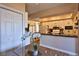 Kitchen with granite countertops, white cabinets, and a breakfast bar at 1409 E St Louis Ave # A, Las Vegas, NV 89104