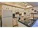 Modern kitchen with granite countertops and stainless steel appliances at 1409 E St Louis Ave # A, Las Vegas, NV 89104
