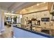 Open concept kitchen with granite island and view into dining area at 1409 E St Louis Ave # A, Las Vegas, NV 89104