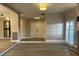 Spacious living room with hardwood floors and recessed lighting leading into the entryway at 1409 E St Louis Ave # A, Las Vegas, NV 89104