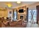 Spacious living room featuring a cozy fireplace and ample natural light at 1409 E St Louis Ave # A, Las Vegas, NV 89104