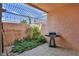 Private patio with grill, lush greenery, and a pergola at 1409 E St Louis Ave # A, Las Vegas, NV 89104