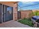 Charming private patio featuring a grill and lush landscaping at 1409 E St Louis Ave # A, Las Vegas, NV 89104