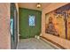 Serene patio with artificial turf, stained glass window, and Buddha print at 1409 E St Louis Ave # A, Las Vegas, NV 89104