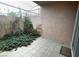 Private patio area enclosed by a metal gate and adorned with climbing plants at 1409 E St Louis Ave # A, Las Vegas, NV 89104