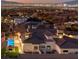 Luxury home with pool and city views at dusk at 1616 Villa Rica Dr, Henderson, NV 89052