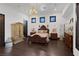 Ornate bedroom with hardwood floors and large wardrobe at 1616 Villa Rica Dr, Henderson, NV 89052
