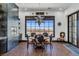 Bright breakfast nook with a view, featuring a wood table and cowhide chairs at 1616 Villa Rica Dr, Henderson, NV 89052