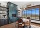 Charming breakfast nook features a wood table, stylish chairs, and a fireplace at 1616 Villa Rica Dr, Henderson, NV 89052