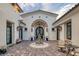 Inviting courtyard entry with fountain and seating area at 1616 Villa Rica Dr, Henderson, NV 89052