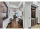 Long hallway with dark wood floors and access to the Primary bathroom at 1616 Villa Rica Dr, Henderson, NV 89052
