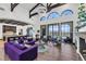 Large living area with hardwood floors, sectional sofa, and views of the backyard at 1616 Villa Rica Dr, Henderson, NV 89052