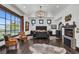 Luxurious main bedroom with fireplace, hardwood floors, and large windows at 1616 Villa Rica Dr, Henderson, NV 89052