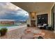 Outdoor patio with fireplace and stunning sunset views at 1616 Villa Rica Dr, Henderson, NV 89052