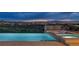Luxury pool and spa with city views at sunset at 1616 Villa Rica Dr, Henderson, NV 89052