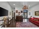 Comfortable sitting area with a cozy sofa and large TV at 1616 Villa Rica Dr, Henderson, NV 89052
