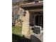 Covered patio with seating area and lawn at 2621 Slide Canyon Ave, North Las Vegas, NV 89081
