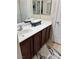 Clean bathroom with dark wood vanity and a single sink at 2621 Slide Canyon Ave, North Las Vegas, NV 89081