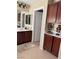 Elegant bathroom with double sinks and dark wood cabinets at 2621 Slide Canyon Ave, North Las Vegas, NV 89081