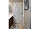 Bathroom featuring a linen closet and a door at 2621 Slide Canyon Ave, North Las Vegas, NV 89081