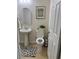 Clean and updated half bathroom with pedestal sink at 2621 Slide Canyon Ave, North Las Vegas, NV 89081