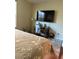 Bedroom with a queen bed, TV, and workspace at 2621 Slide Canyon Ave, North Las Vegas, NV 89081