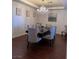 Elegant dining room with hardwood floors, chandelier, and seating for six at 2621 Slide Canyon Ave, North Las Vegas, NV 89081