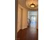 Bright entryway with hardwood floors and a view to the living room at 2621 Slide Canyon Ave, North Las Vegas, NV 89081