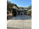 Two-story house with attached garage and landscaping at 2621 Slide Canyon Ave, North Las Vegas, NV 89081