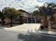 Two-story home with three-car garage and landscaping at 2621 Slide Canyon Ave, North Las Vegas, NV 89081