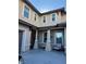 Two-story home with front porch and seating area at 2621 Slide Canyon Ave, North Las Vegas, NV 89081